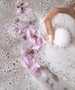 Relaxing bubble bath with lavender bath soak, creating a calming and soothing at-home spa atmosphere.