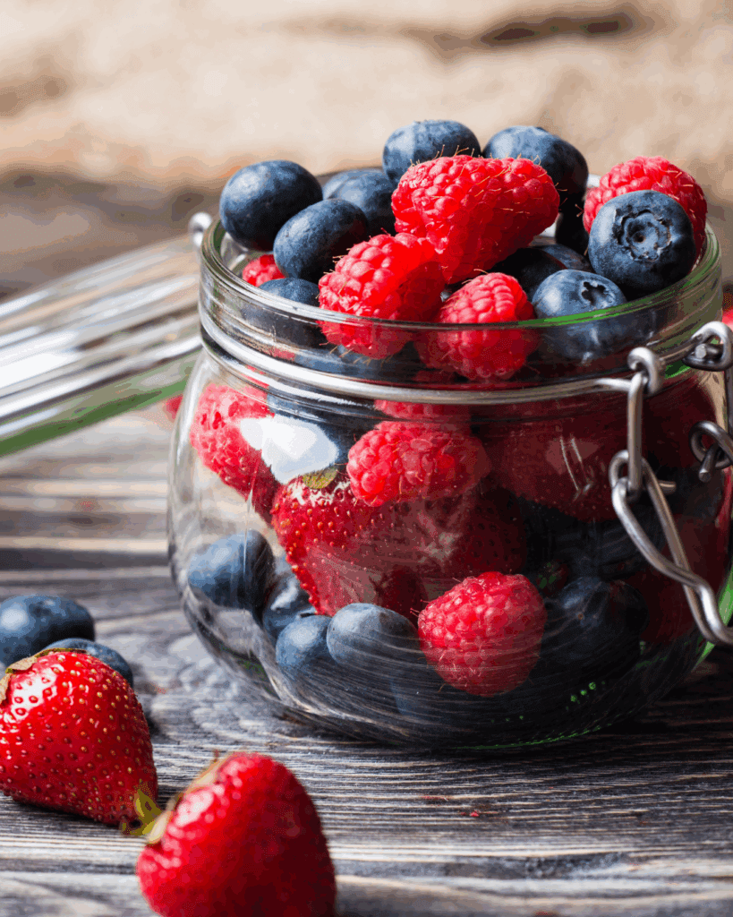 Fresh mixed berries in a glass bowl for a simple, mood-boosting snack