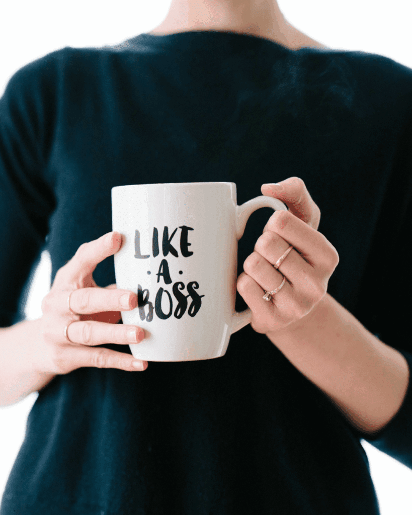 Woman holding her favorite aesthetic mug, enjoying a quiet wellness moment