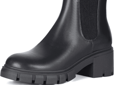 A product image of shiny, chunky black boots, ankle height.